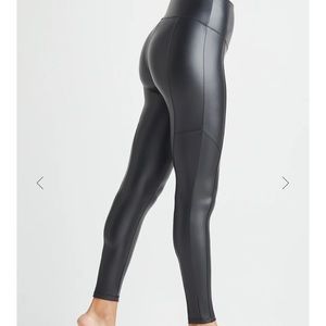 Yummie size S black faux leather shaping legging with front and back seam. EUC